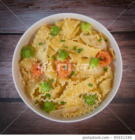 Homemade pasta with smoked salmon, broccoli, parmesan and lemon, healthy food 95831346