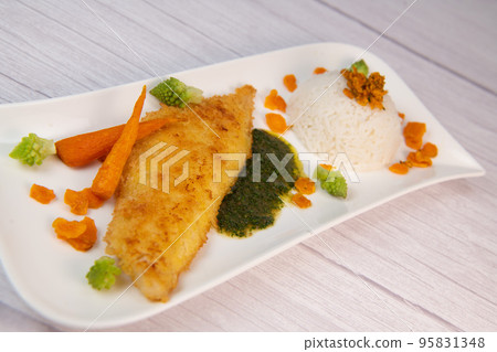 Recipe for Hake fillet breaded with panko, rice, carrot chips and coriander sauce Recipe for Hake fillet breaded with panko, rice, carrot chips and coriander sauce 95831348