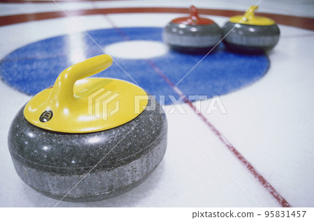 Granite stones for curling game on the ice Granite stones for curling game on the ice 95831457