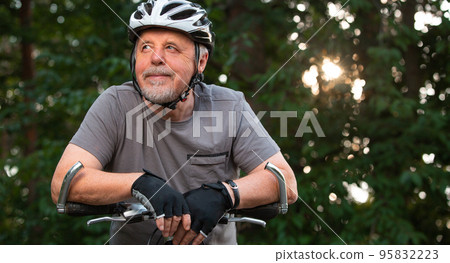 Portrait of active senior man with his bike in outside, healthy lifestyle sport concept Portrait of active senior man with his bike in outside, healthy lifestyle sport concept 95832223