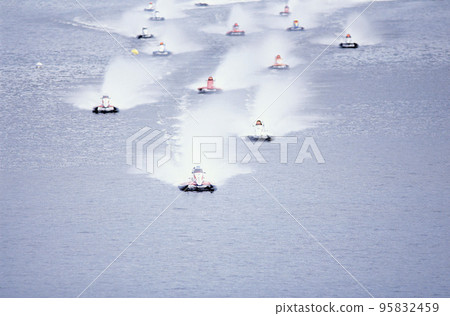 jet-ski racing on a blue water jet-ski racing on a blue water 95832459