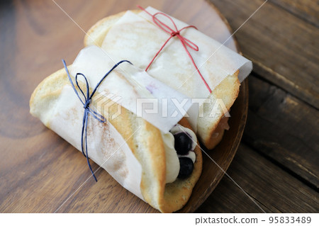 Fruit omelette cake wrapped in glassine paper Fruit omelette cake wrapped in glassine paper 95833489