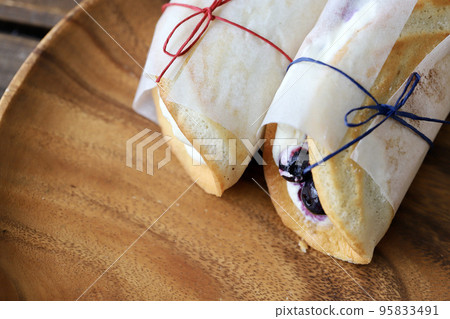 Fruit omelette cake wrapped in glassine paper Fruit omelette cake wrapped in glassine paper 95833491