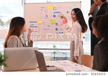 Start up businesspeople sharing ideas business strategy, collaborating on new project at marketing workshop Start up businesspeople sharing ideas business strategy, collaborating on new project at marketing workshop 95834352