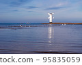 Old windmill lighthouse in Swinoujscie, a port in Poland on the Baltic Sea. 95835059