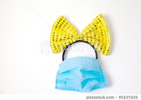yellow bow and medical mask 95835920