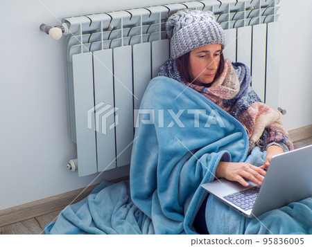 Woman sitting near the battery 95836005