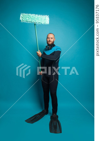 Clean and environmental protection concept. Diver with mop on blue background 95837176