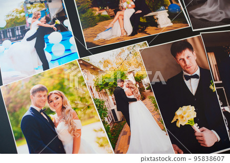 printed wedding photos on a black background. printed wedding photos on a black background. 95838607