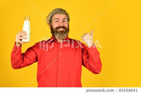 Shop advertisement. Healthy habits. Prepare plants milk at home. How to be dairy free. Lactose intolerance. Bearded man hold milk bottle. Pasteurized milk. Vegan milk concept. Drink protein cocktail Shop advertisement. Healthy habits. Prepare plants milk at home. How to be dairy free. Lactose intolerance. Bearded man hold milk bottle. Pasteurized milk. Vegan milk concept. Drink protein cocktail 95838641