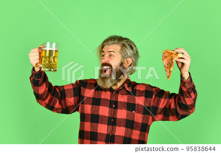 Finally pizza time. Pizza is better when shared. Pizzeria restaurant. Gourmet food. Cheerful man bearded hipster hold pizza. Hungry man going to eat pizza and drink beer. Perfect rest in pub 95838644