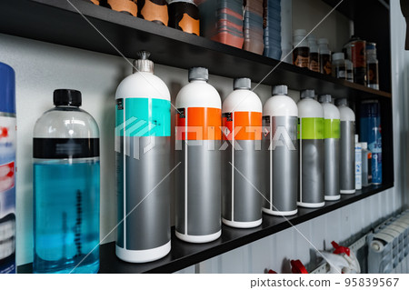 Plastic bottles with car cleaning chemical bottles in car service 95839567