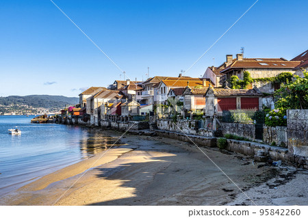 Fishing village of Combarro with the typical granary horreos. Galicia, Spain. 95842260