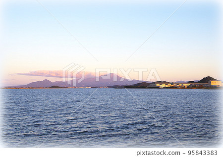 A view of Daisen in late autumn, faintly reddish under the setting sun, seen beyond Nakaumi (illustration style) 95843383