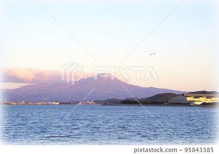 A view of Daisen in late autumn, faintly reddish under the setting sun, seen beyond Nakaumi (illustration style) 95843385