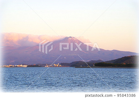 A view of Daisen in late autumn, faintly reddish under the setting sun, seen beyond Nakaumi (illustration style) A view of Daisen in late autumn, faintly reddish under the setting sun, seen beyond Nakaumi (illustration style) 95843386