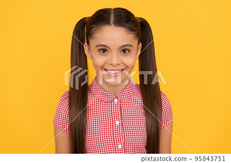 Innocent girl child happy smiling yellow background, girlhood 95843751