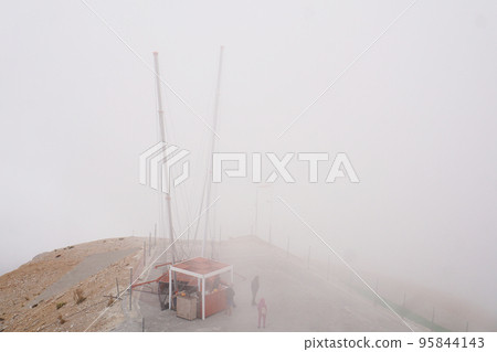 Slingshot attraction on the top of Tahtali mountan with fog sky background Slingshot attraction on the top of Tahtali mountan with fog sky background 95844143