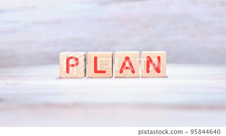 PLAN text on wooden cubes on a light background PLAN text on wooden cubes on a light background 95844640