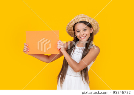 teen child smile with copy space on orange paper on yellow background teen child smile with copy space on orange paper on yellow background 95846782