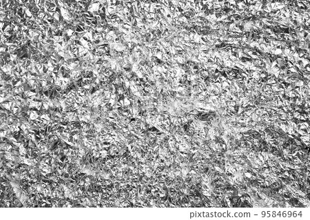 Crumpled silver foil as background, closeup view 95846964