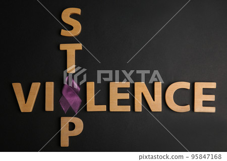 Purple ribbon and phrase STOP VIOLENCE on black background, flat lay 95847168