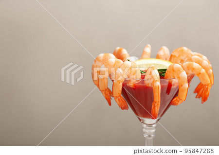 Shrimp cocktail with tomato sauce on light grey background. Space for text Shrimp cocktail with tomato sauce on light grey background. Space for text 95847288