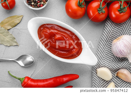 Flat lay composition with tomato sauce on light grey table Flat lay composition with tomato sauce on light grey table 95847412
