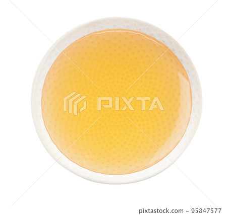 Bowl of organic honey isolated on white, top view 95847577