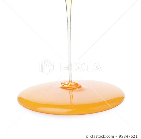 Pouring sweet fresh honey isolated on white 95847621