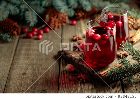 Christmas drink with spices and cranberries. Christmas drink with spices and cranberries. 95848153