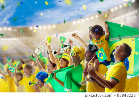 Brazil football team supporter on stadium. 95848228