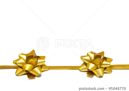 Two golden gift bows with a ribbon on a white background with copy space. isolated object. Universal template for postcards, posters, banners. 95848770