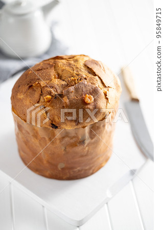 Panettone Christmas Cake. Italian sweet bread on white kitchen table. 95849715
