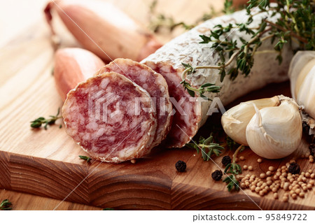 Traditional dry-cured sausage with thyme, garlic, onion, and spices. Traditional dry-cured sausage with thyme, garlic, onion, and spices. 95849722