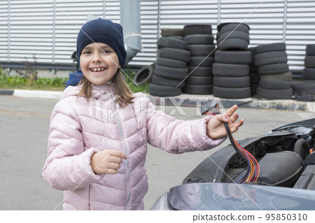 Auto mechanic working in garage. Repair service 95850310