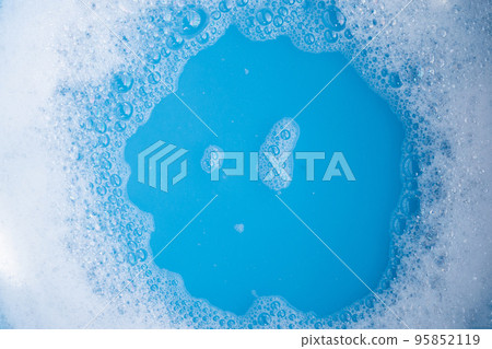Detergent foam bubble, blue background. Detergent foam bubble, blue background. 95852119