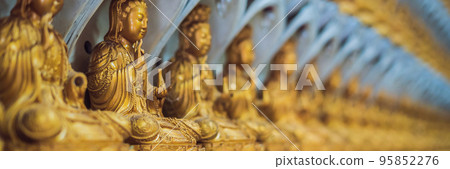 The wall in the temple is filled with buddhas. Religion Buddhism concept. Texture, background Buddhism BANNER long format The wall in the temple is filled with buddhas. Religion Buddhism concept. Texture, background Buddhism BANNER long format 95852276