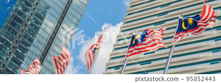 Flags of Malaysia against the background of skyscrapers BANNER long format Flags of Malaysia against the background of skyscrapers BANNER long format 95852443