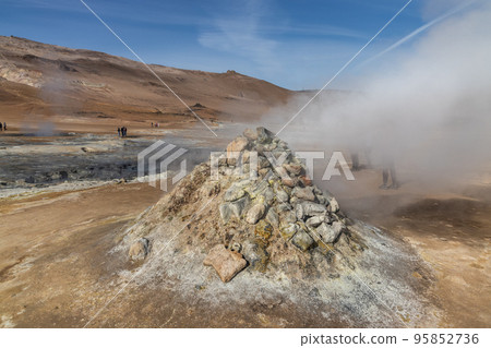 Close-up of steaming fumaroles at Namafjall, Iceland popular geothermal area with a unique landscape of steaming pools and mudpots. Close-up of steaming fumaroles at Namafjall, Iceland popular geothermal area with a unique landscape of steaming pools and mudpots. 95852736