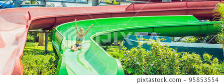 woman is having fun in the water park BANNER, long format 95853554