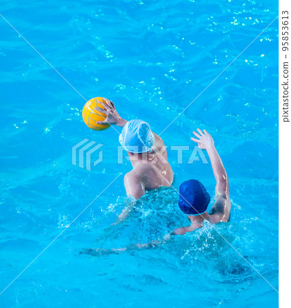 Young men play water polo Young men play water polo 95853613