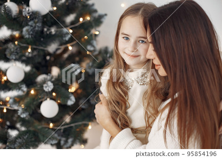 Mother with little daughter at home 95854196