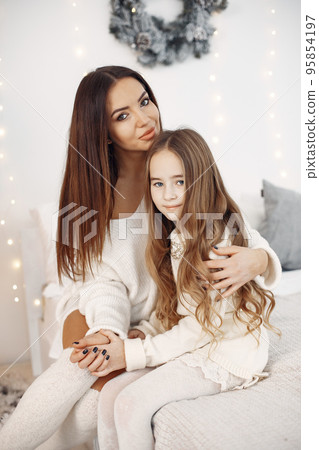 Mother with little daughter at home 95854197