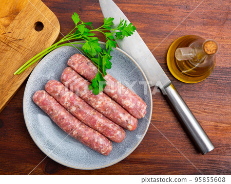 Delicious butifarra on plate with herbs and olive oil 95855608
