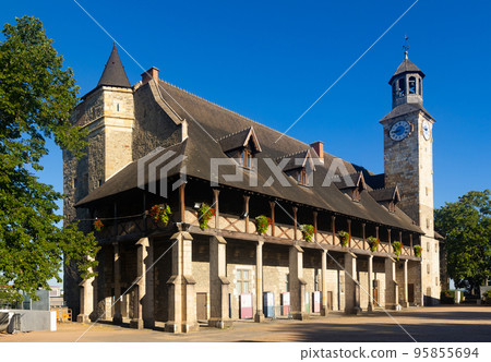 Medieval Chateau of Dukes of Bourbon decorated with flowers in Montlucon, France 95855694