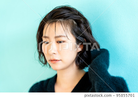 short bob woman wearing black knit short bob woman wearing black knit 95855701