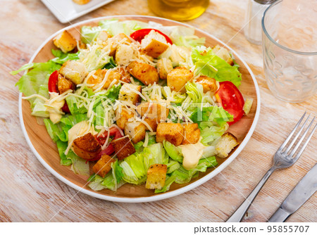 Caesar salad with grilled chicken and croutons 95855707