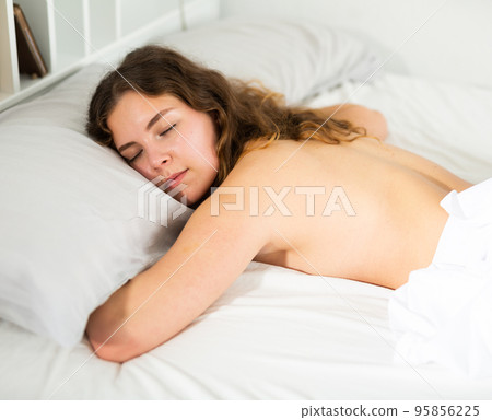 Attractive girl sleeping in bed 95856225