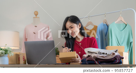 Startup small business entrepreneur of freelance Asian woman using a laptop with box Cheerful success online marketing packaging box and delivery SME idea concept Startup small business entrepreneur of freelance Asian woman using a laptop with box Cheerful success online marketing packaging box and delivery SME idea concept 95857727